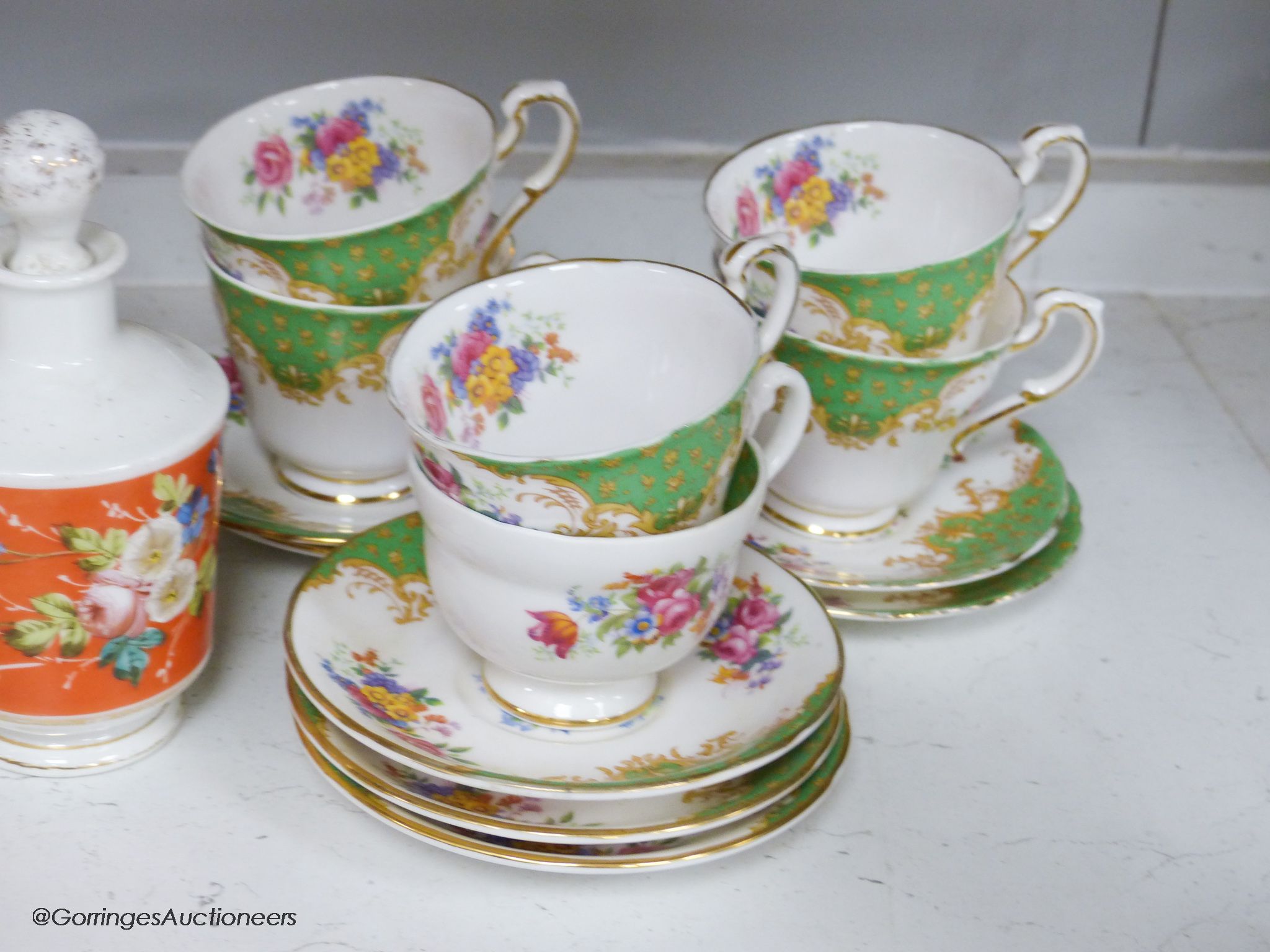 A Paragon tea set, three ceramic perfume bottles and stoppers and a Wedgwood commemorative mug